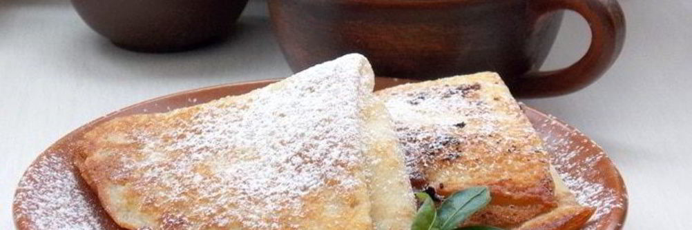 Блинчики с творогом, изюмом и апельсиновой цедрой