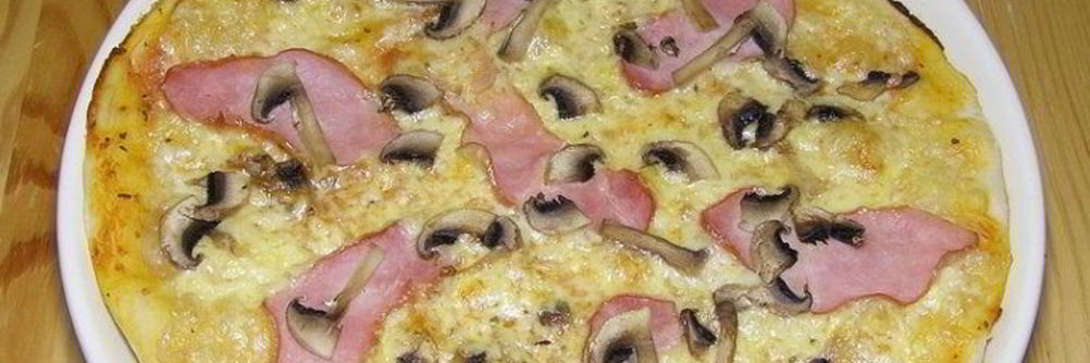Пицца с ветчиной и шампиньонами